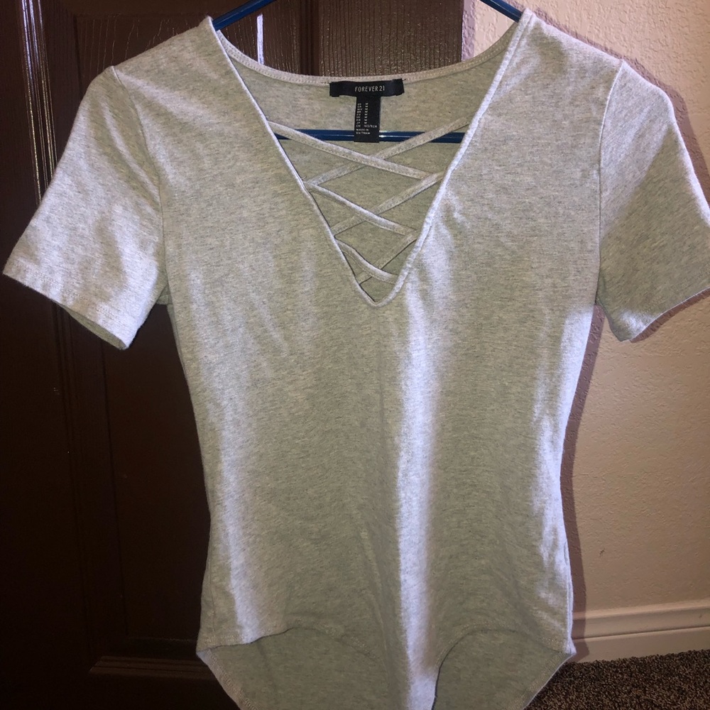 Grey body suit with criss crossed v-neck